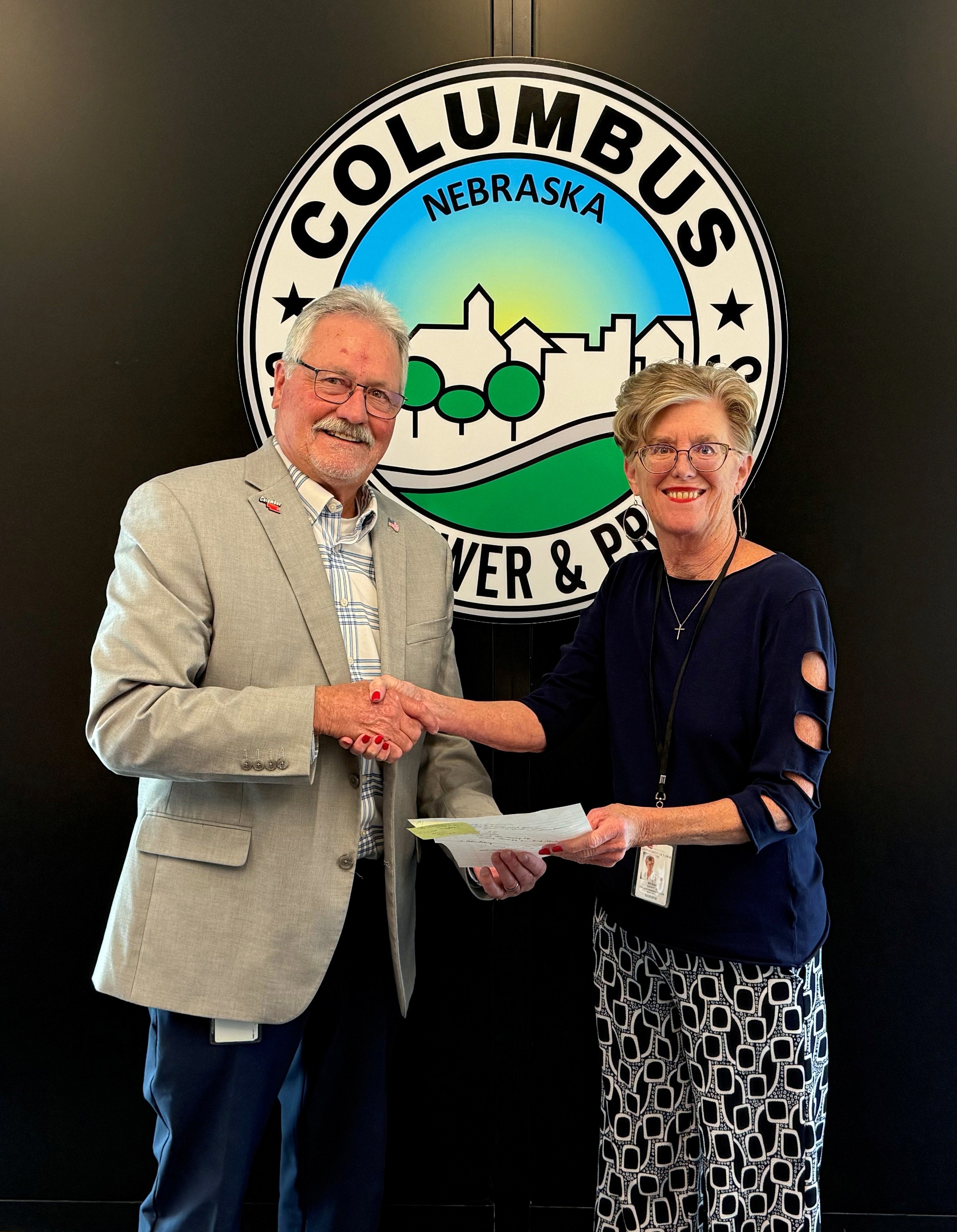 Jim Bulkley, Columbus Mayor (left), and Bernie Hansen, Regional Reemployment Services Manager, receiving National Apprenticeship Week Proclamation at the Columbus City Council meeting