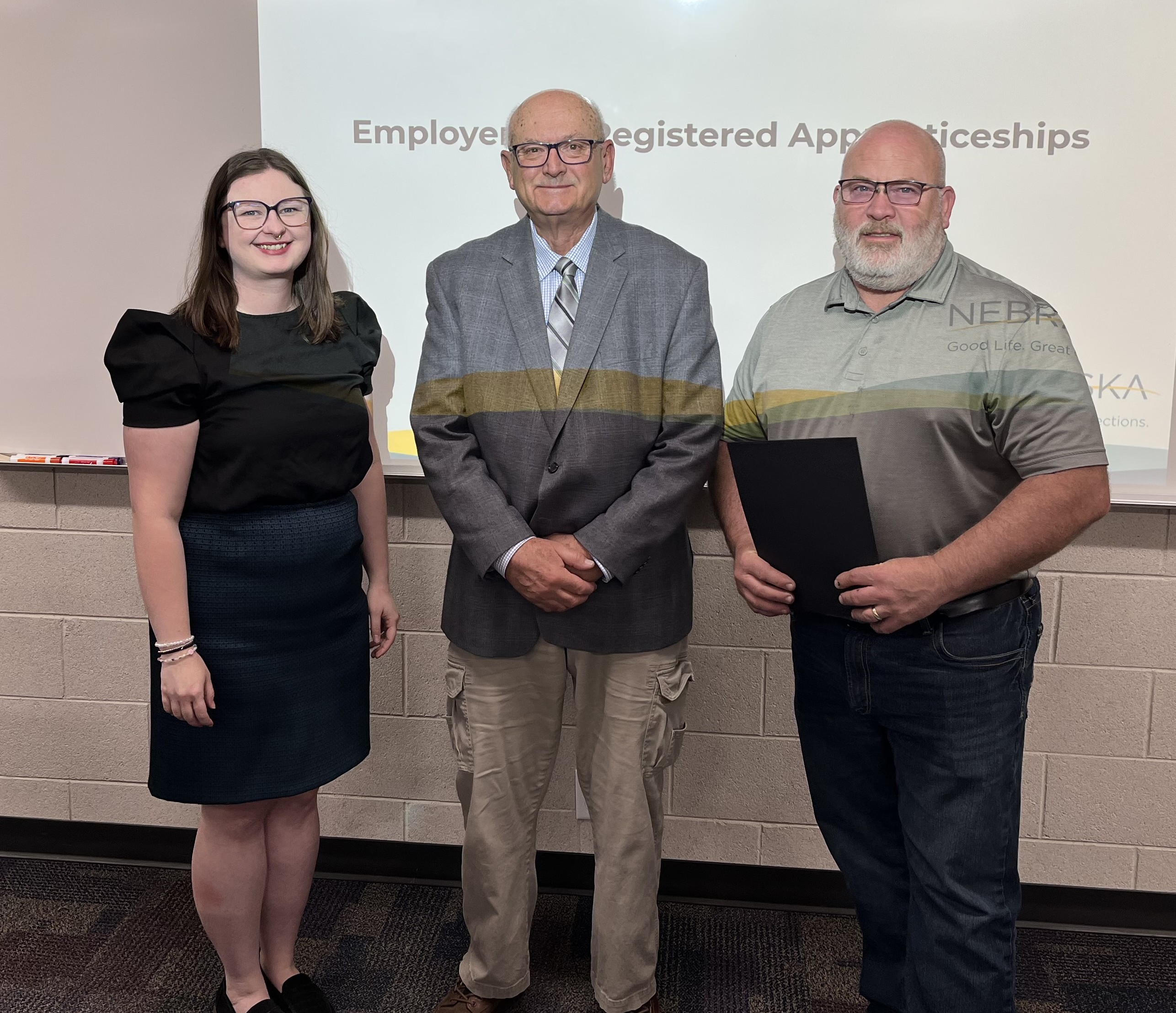 From left: Delta Wilson, Registered Apprenticeship Program Coordinator; Jim Nisley, North Platte Council President; and Brent LeClair, Regional Reemployment Services Manager, receiving National Apprenticeship Week Proclamation in North Platte.